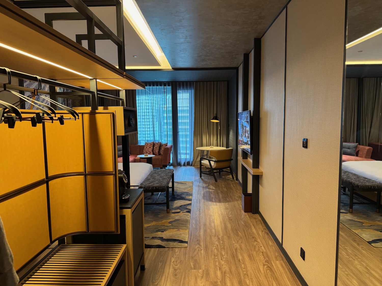 a room with a bed and a tv