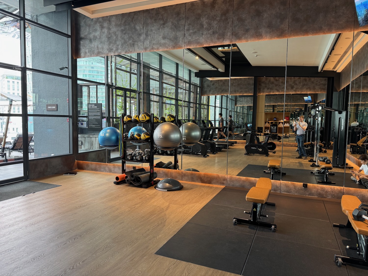 a mirror of a gym with exercise equipment