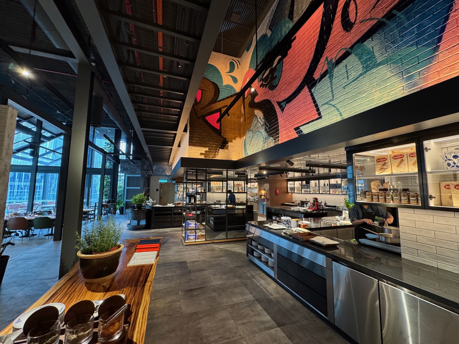 a restaurant with a large wall and a large window