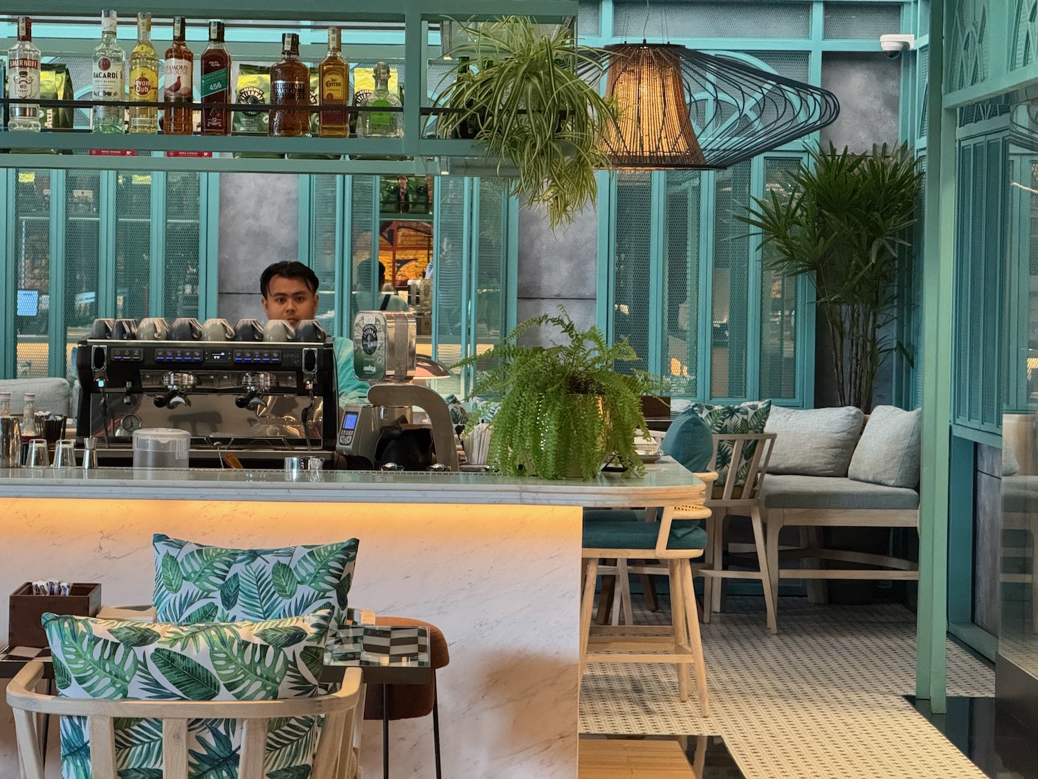 a man behind a counter in a restaurant