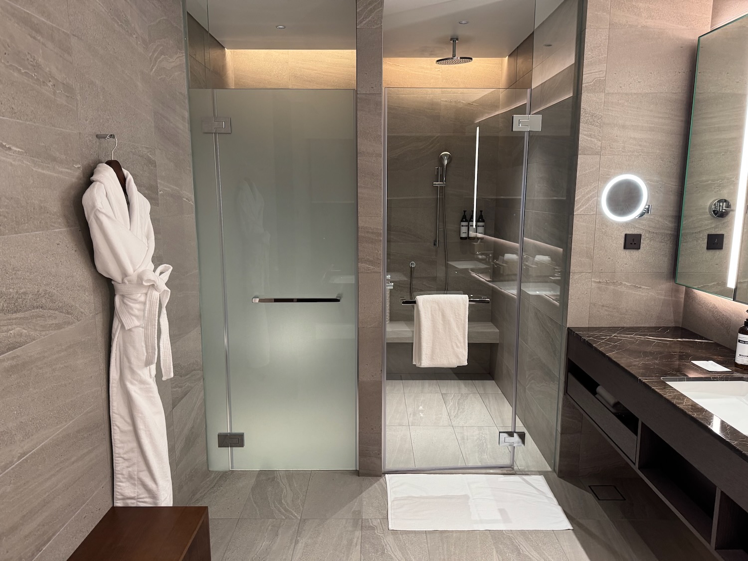 a bathroom with a glass shower door