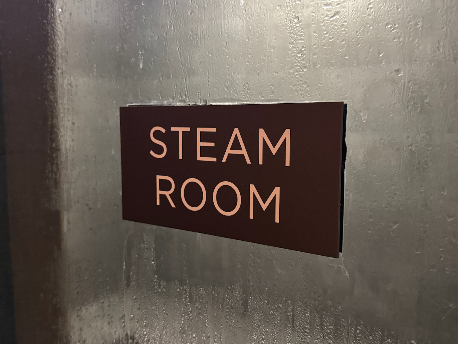 a sign on a wet wall