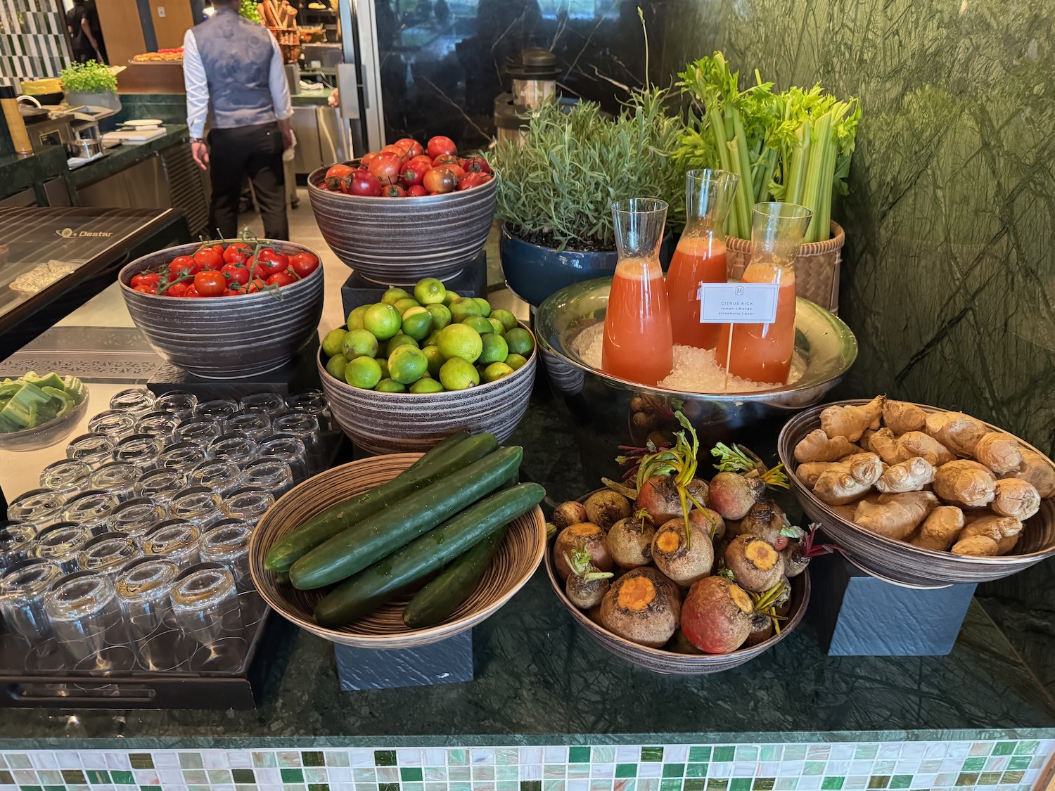 a group of bowls of vegetables and juices