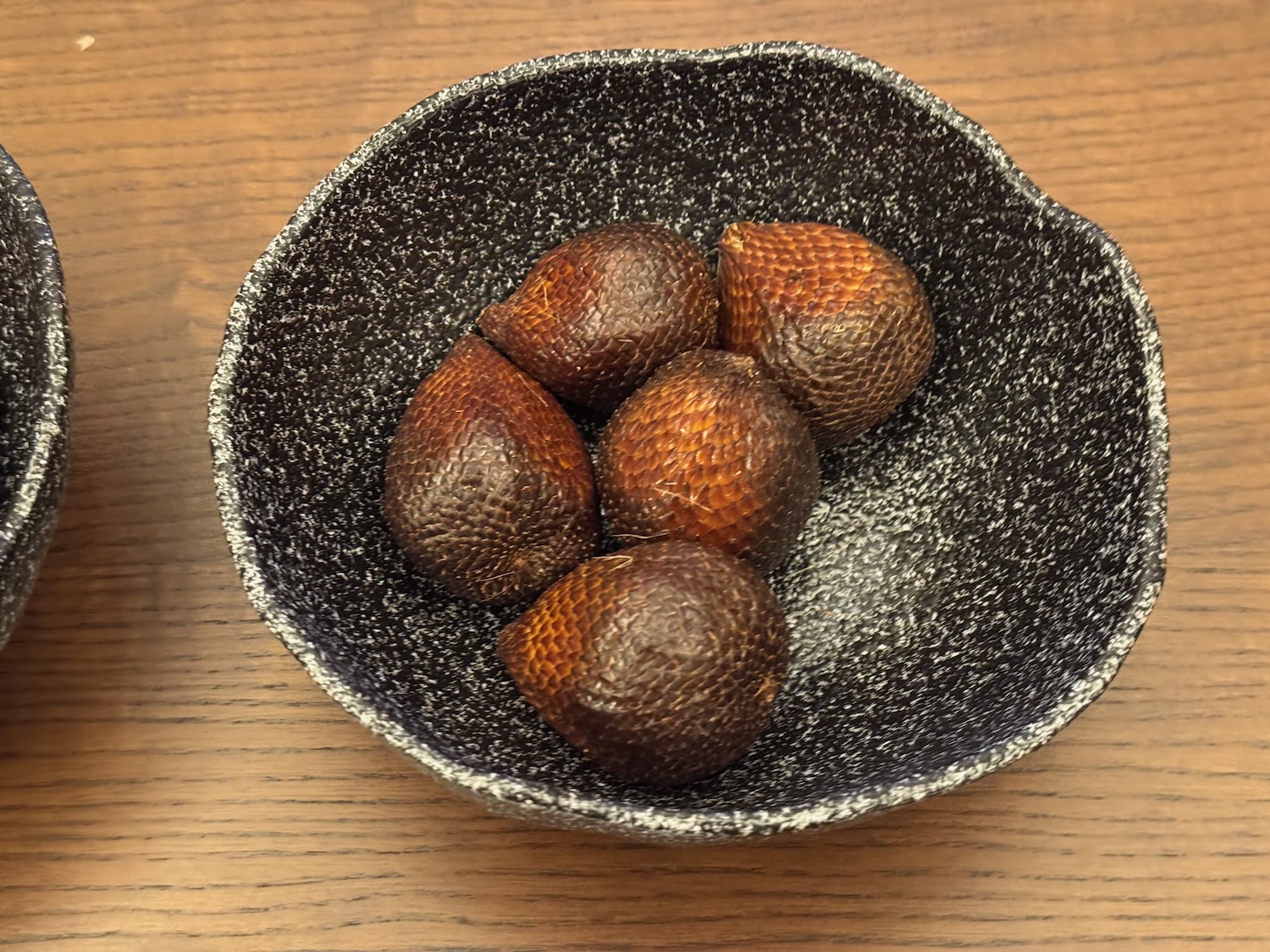 a bowl of fruit on a table