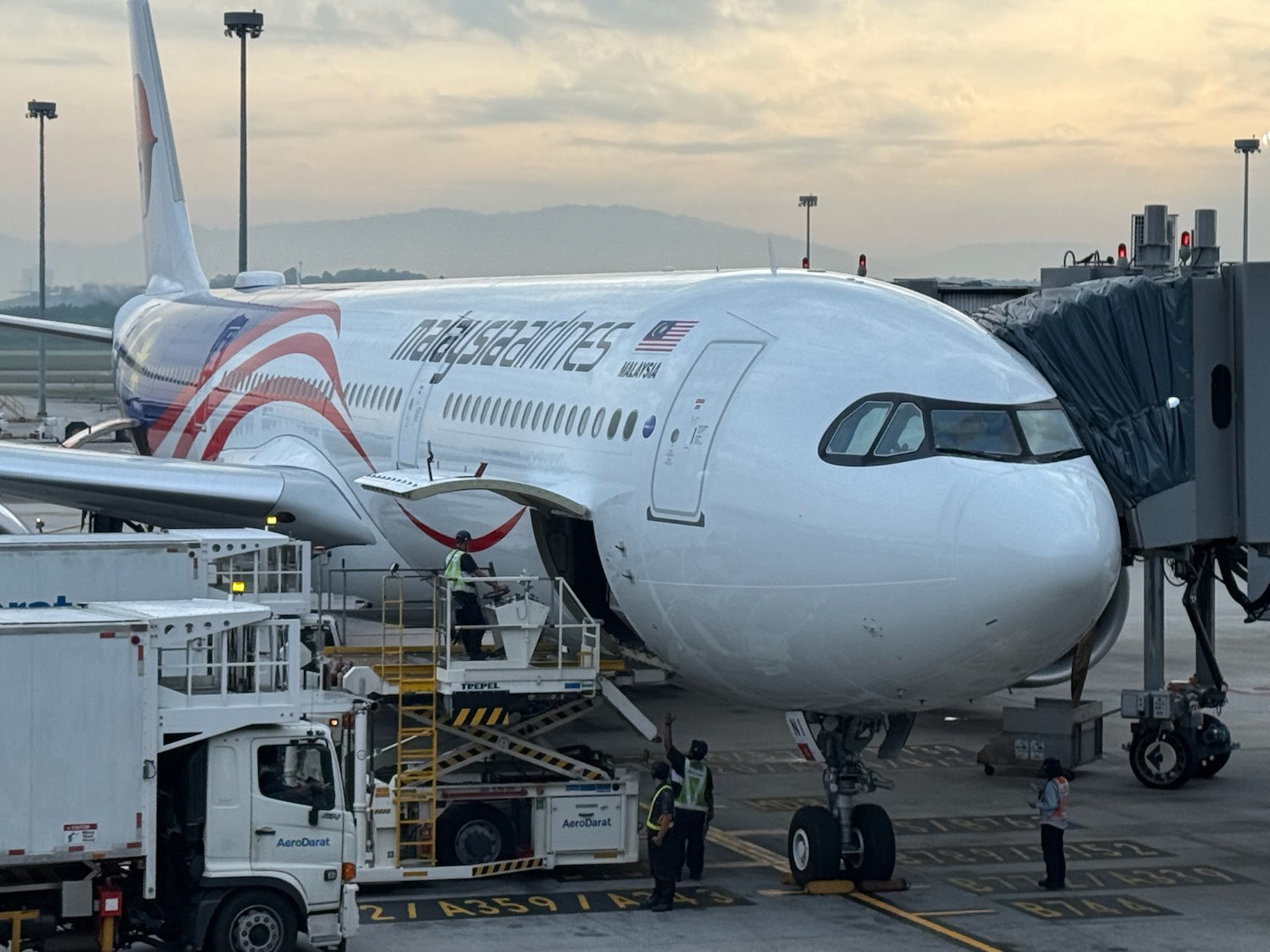 a large white airplane with a red and blue design on it