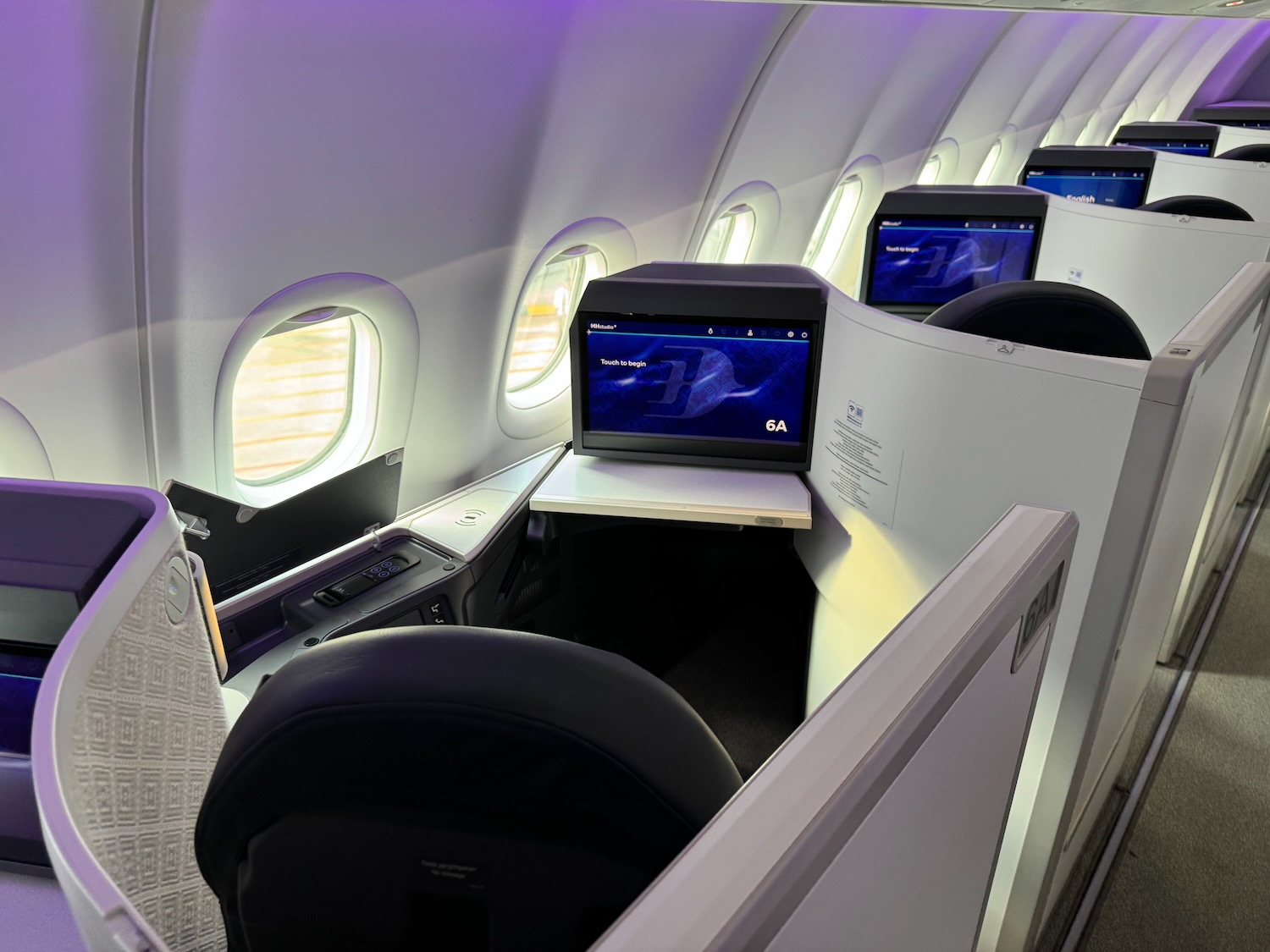 a row of monitors on an airplane