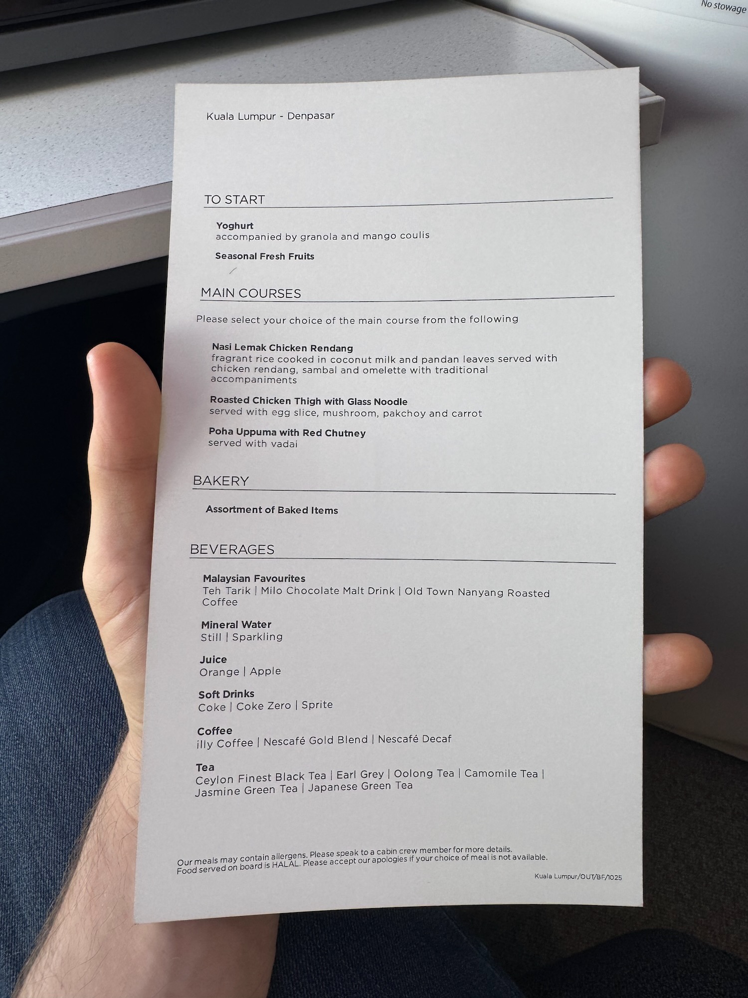 a hand holding a piece of paper