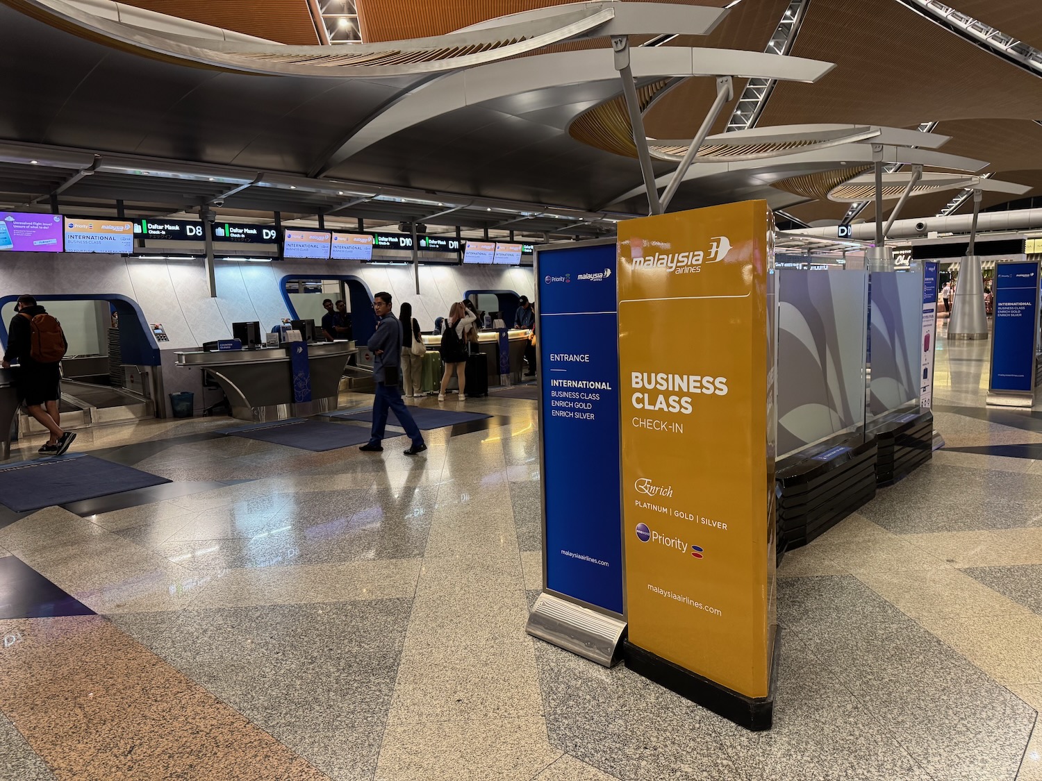 a group of people walking in a building