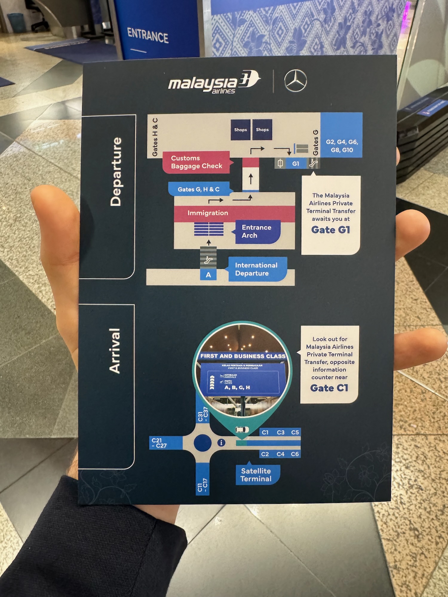 a hand holding a sign