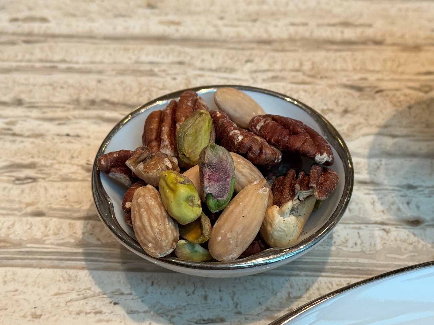 a bowl of nuts on a table