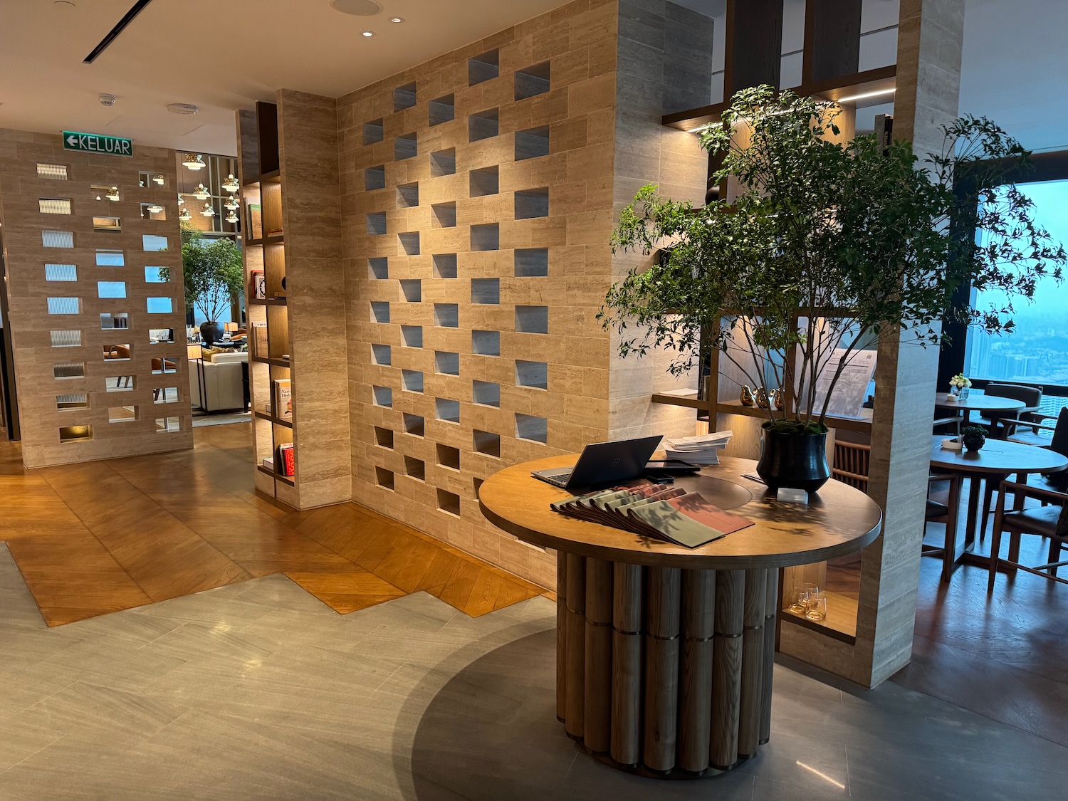a room with a table and a potted tree