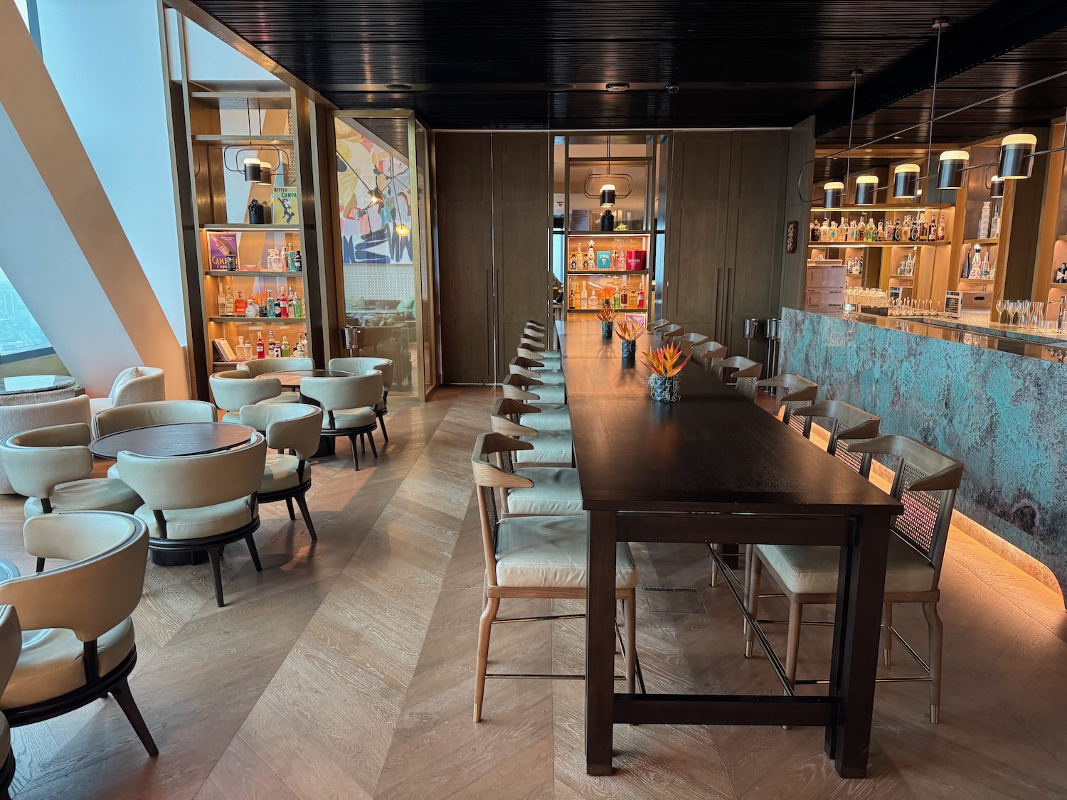 a room with a long table and chairs