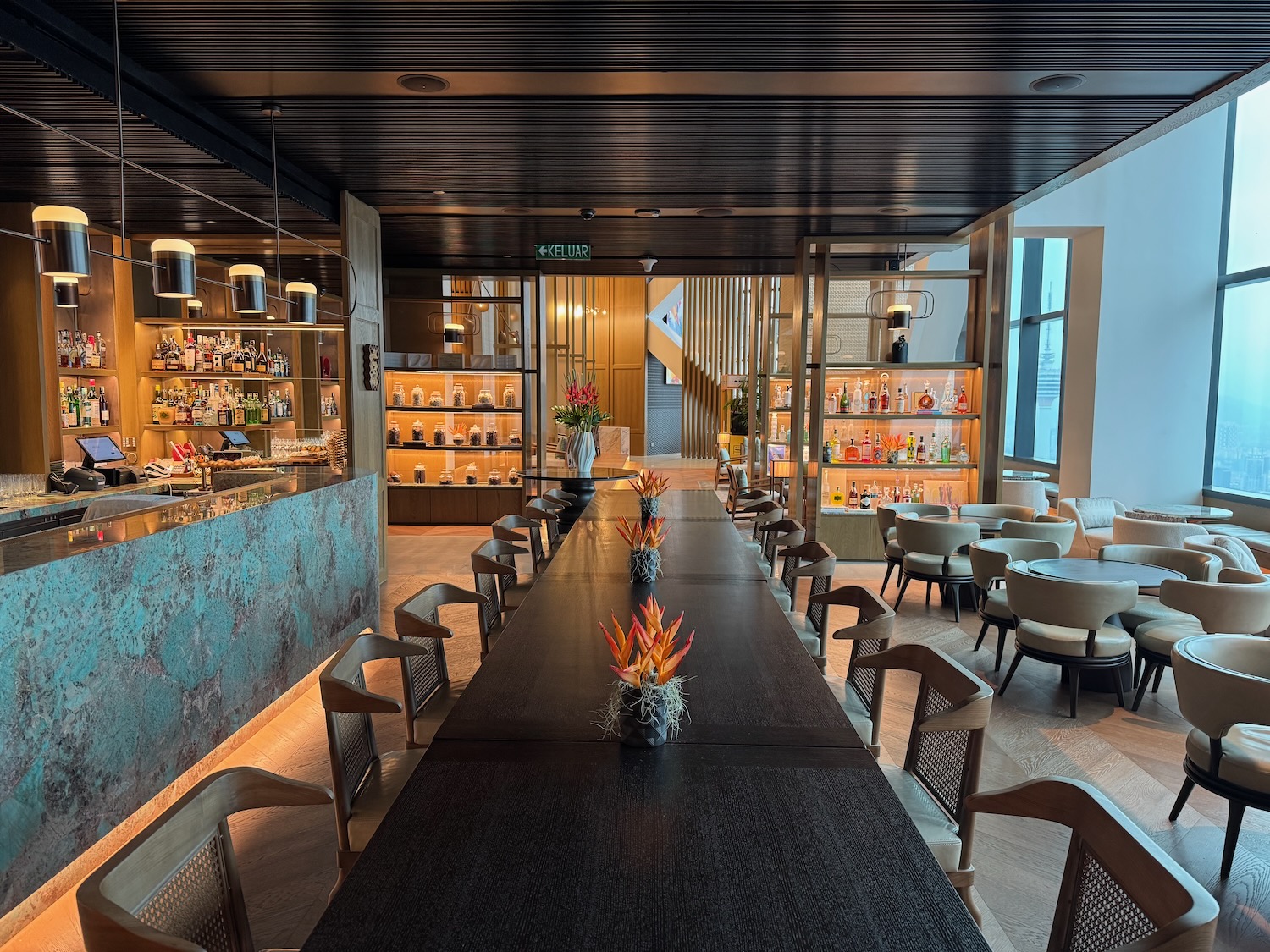 a long table with chairs and a bar