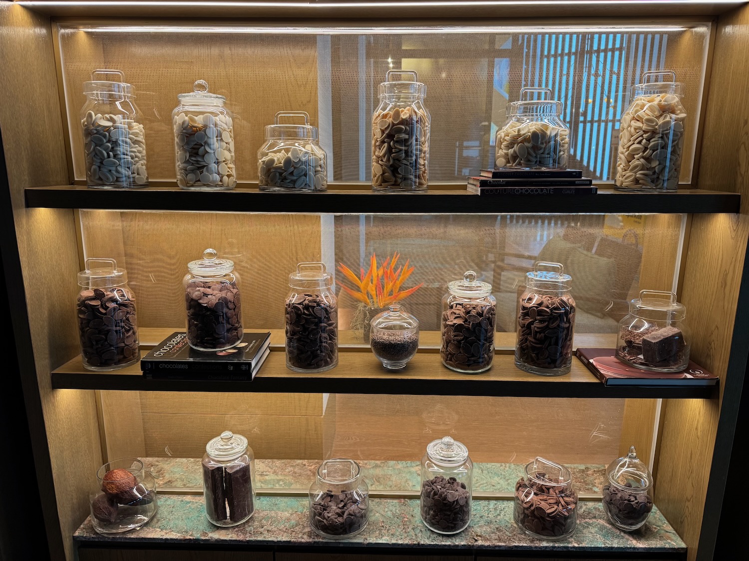 a shelf with glass jars of food