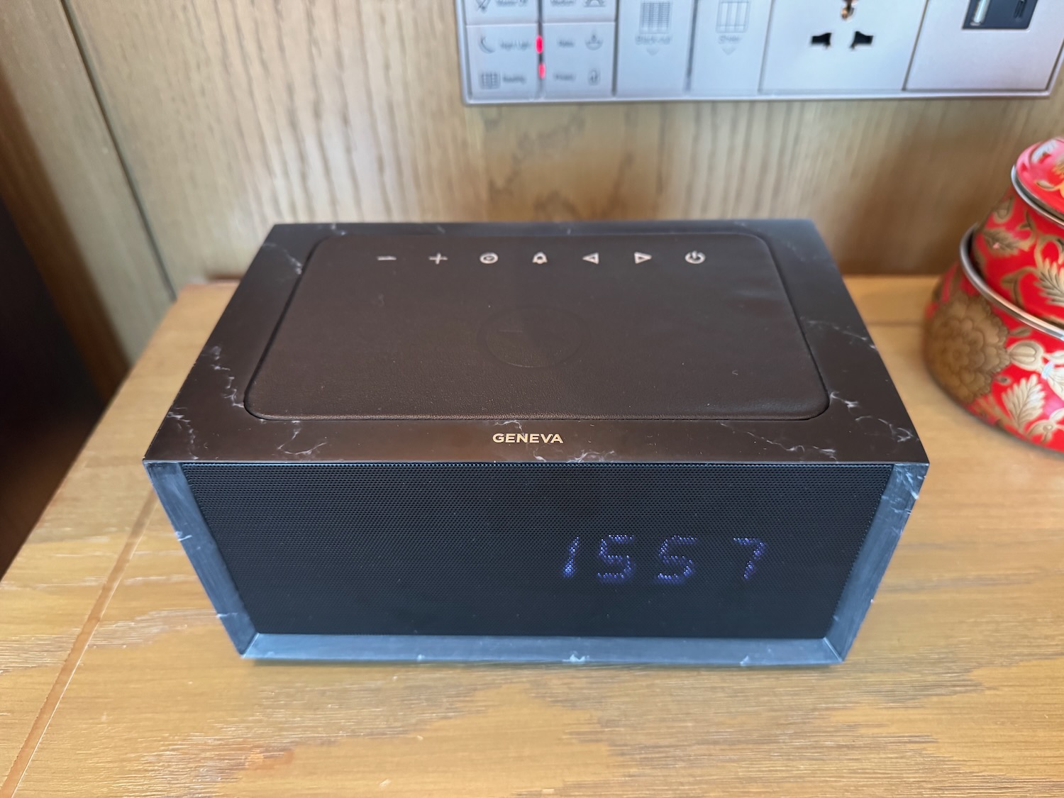 a rectangular black device with buttons and numbers on it