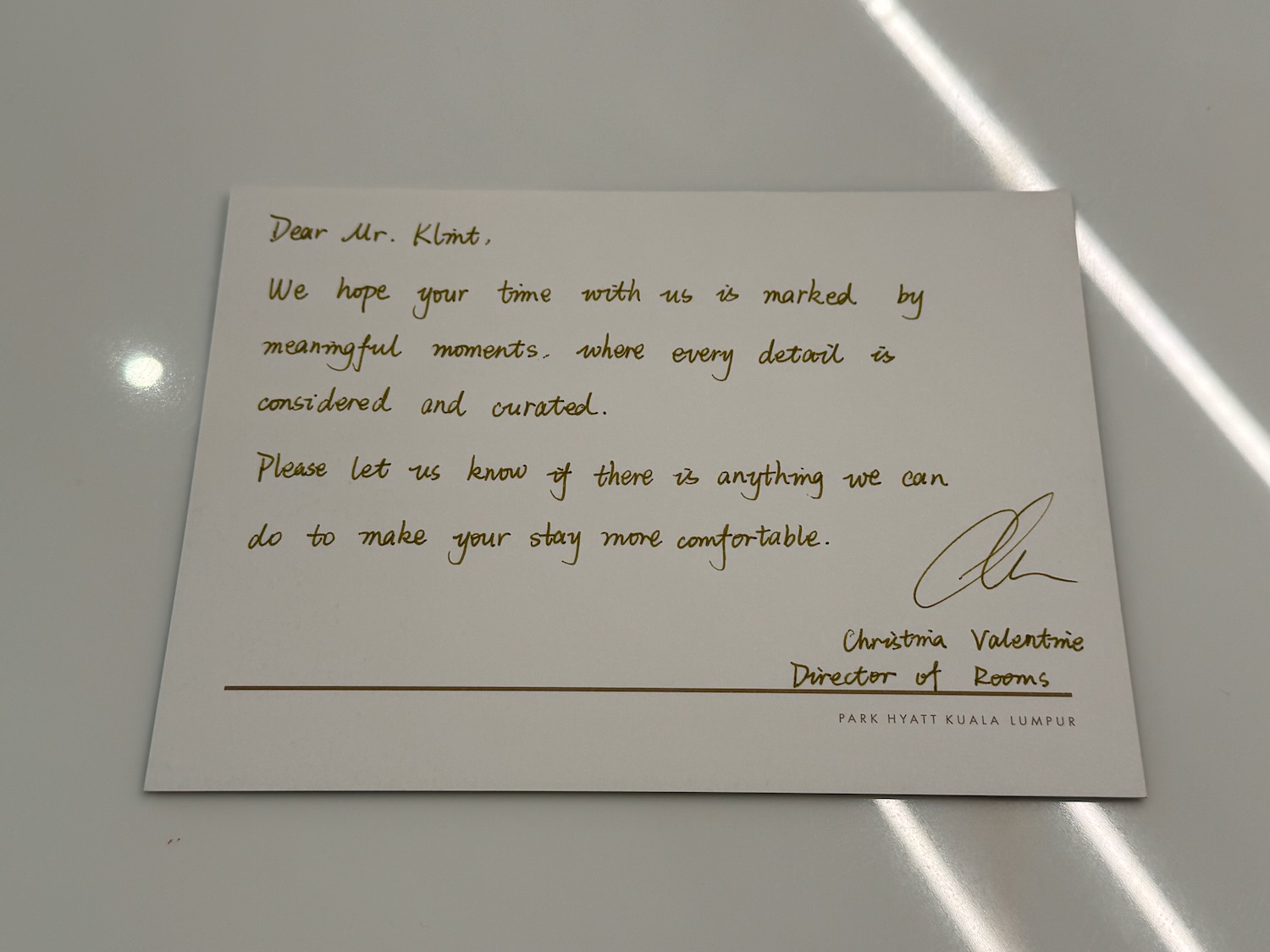 a letter on a white surface