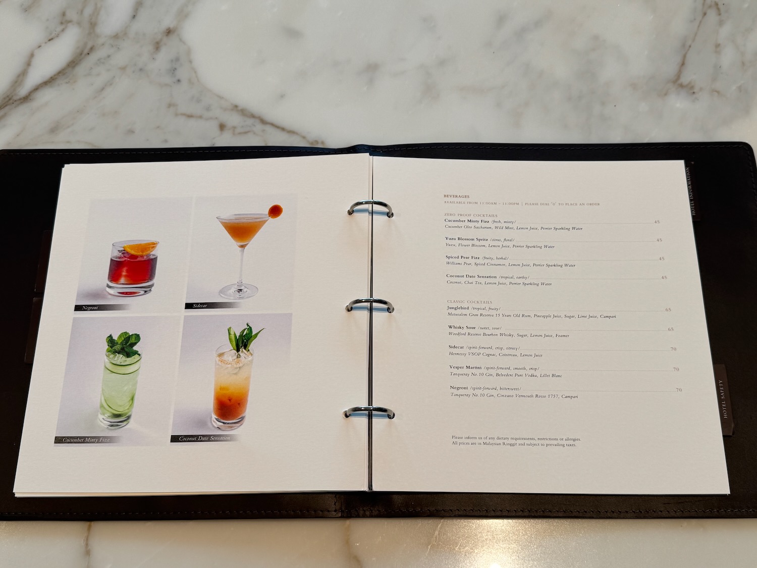 a menu book with different drinks on it
