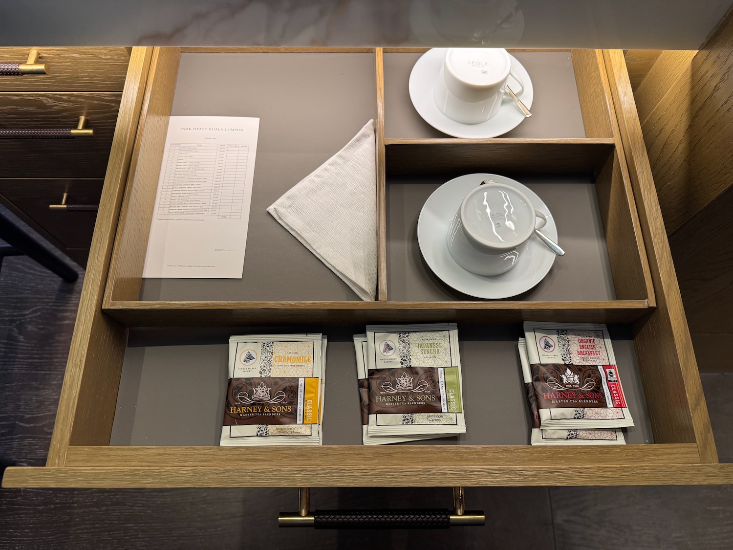 a tray with tea cups and saucers