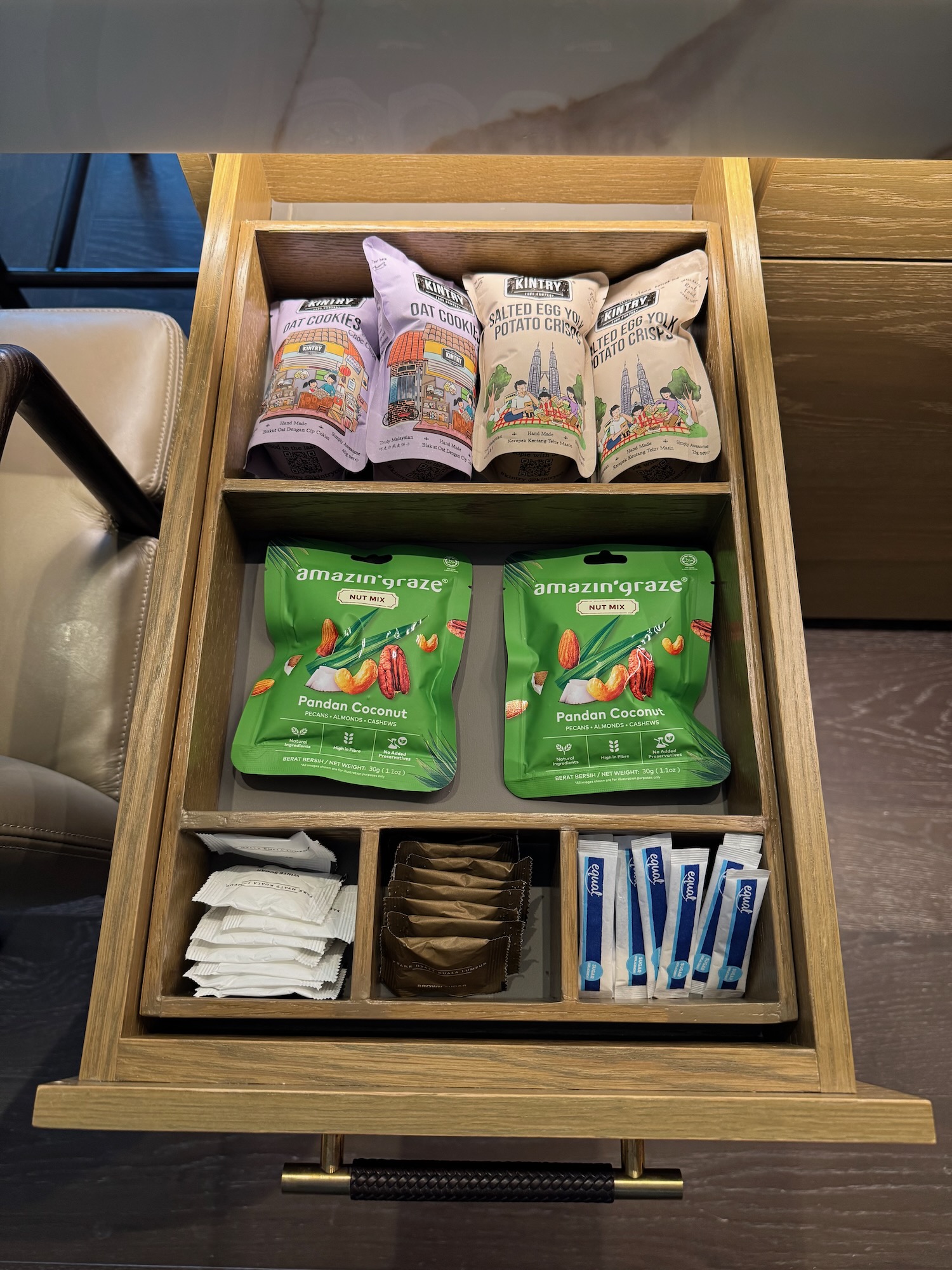 a drawer with different packages and condiments