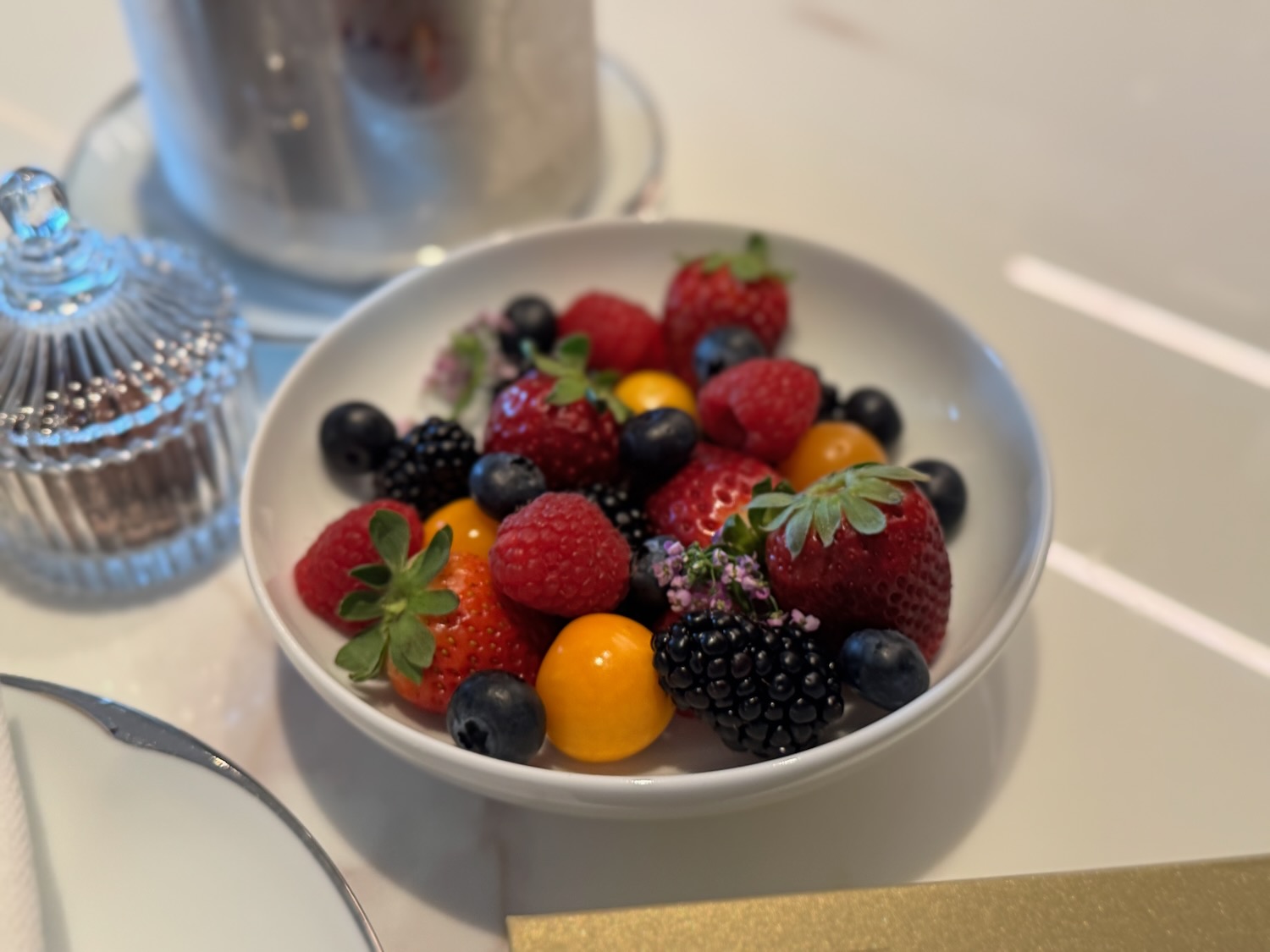 a bowl of fruit on a table