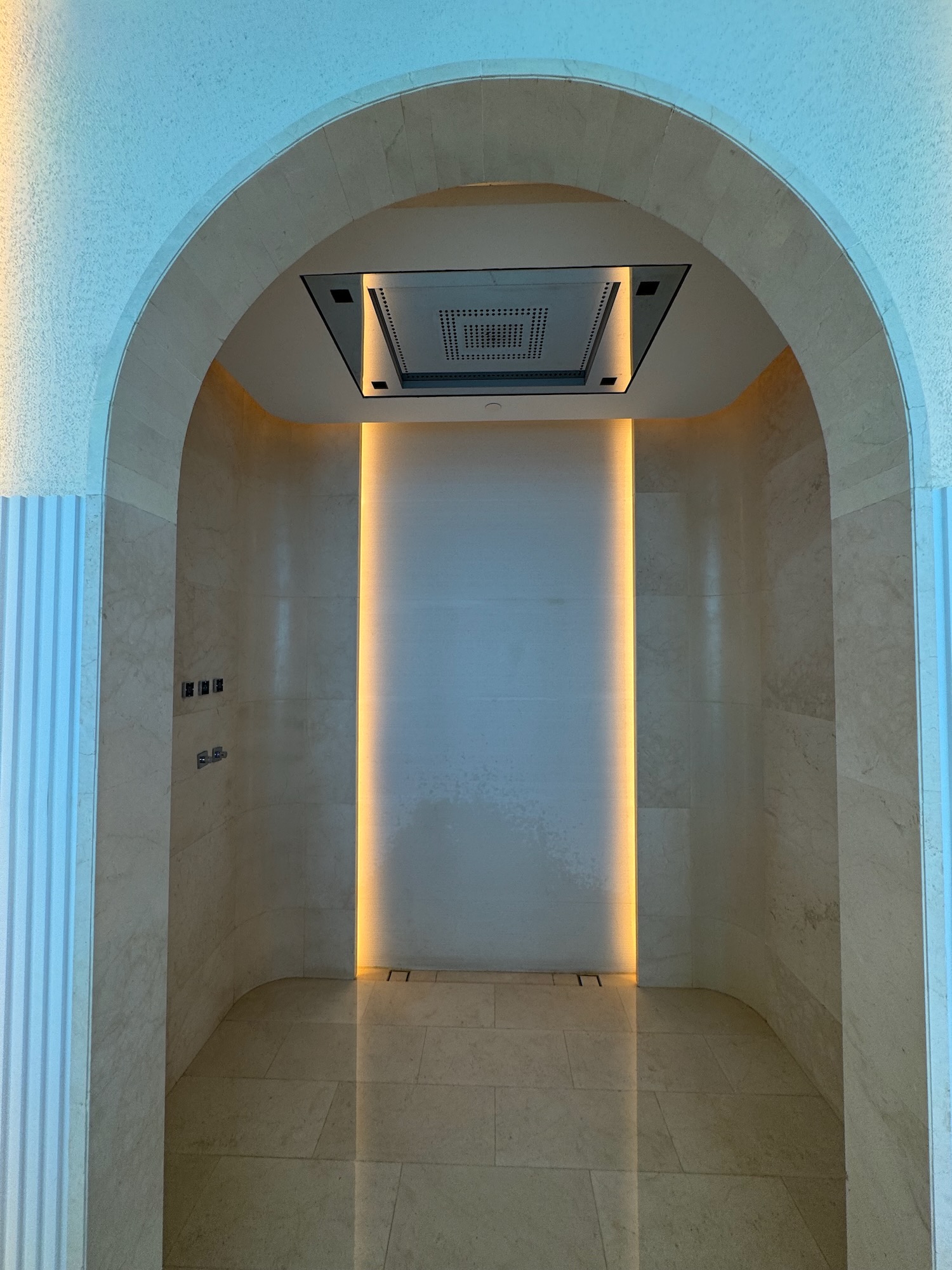 a room with a vent and a tile floor