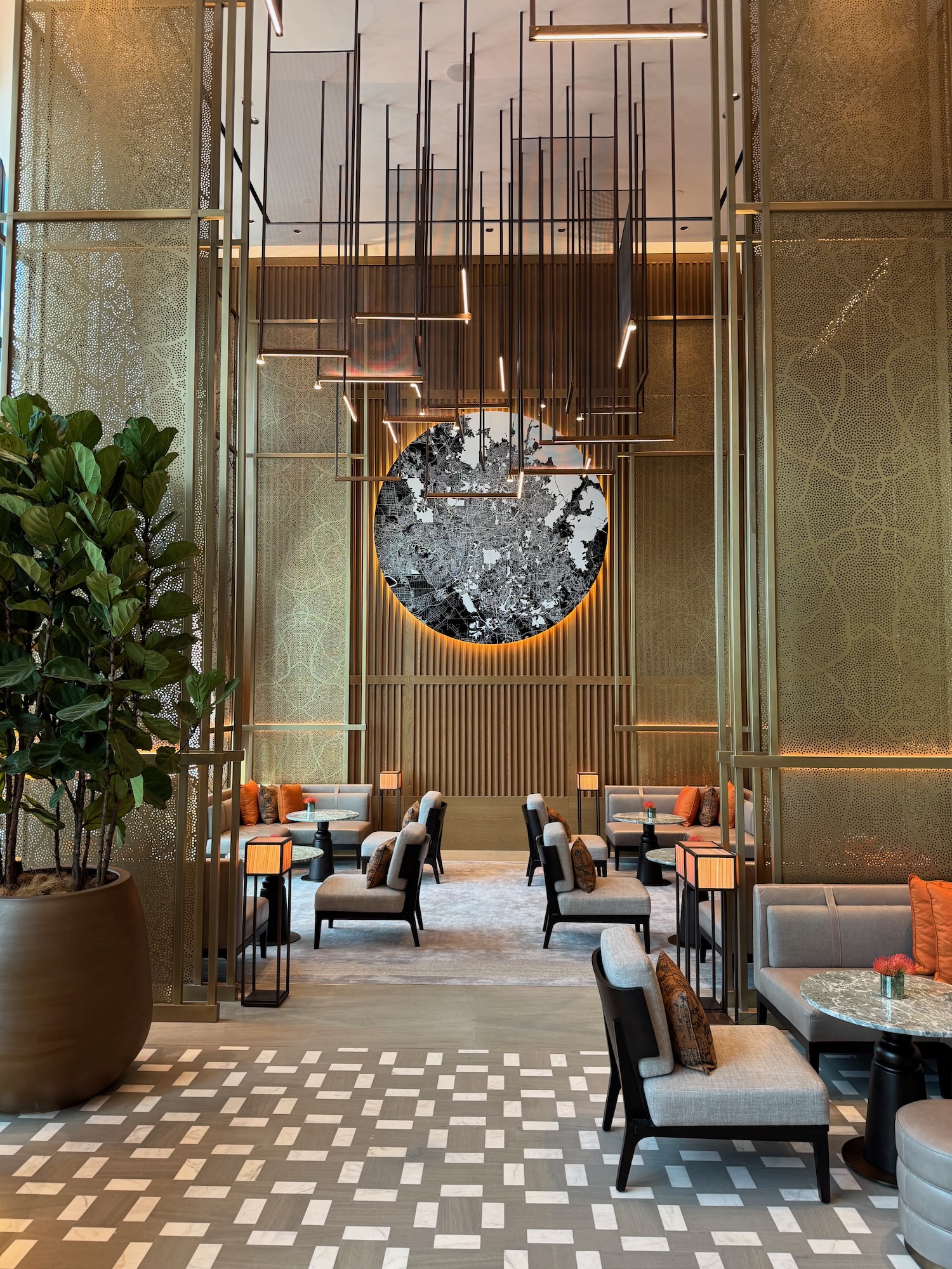 a room with chairs and a plant