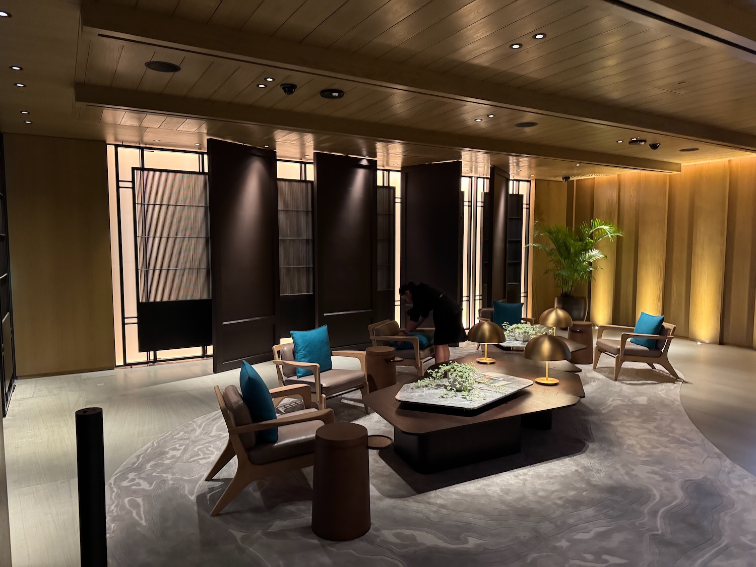 a room with a round table and chairs