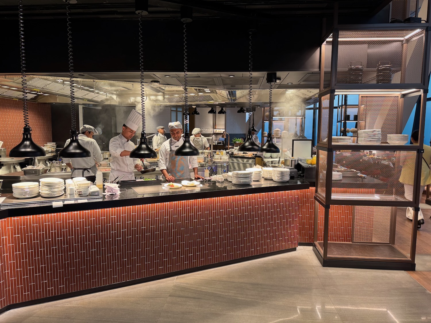 a group of chefs cooking in a kitchen