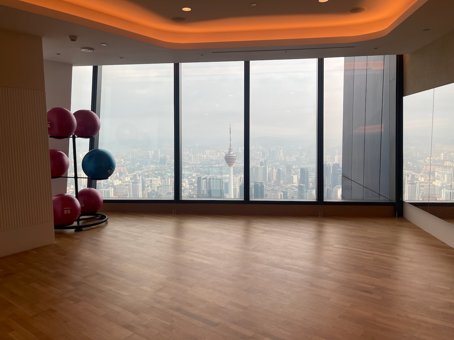 a large room with large windows and a large city view