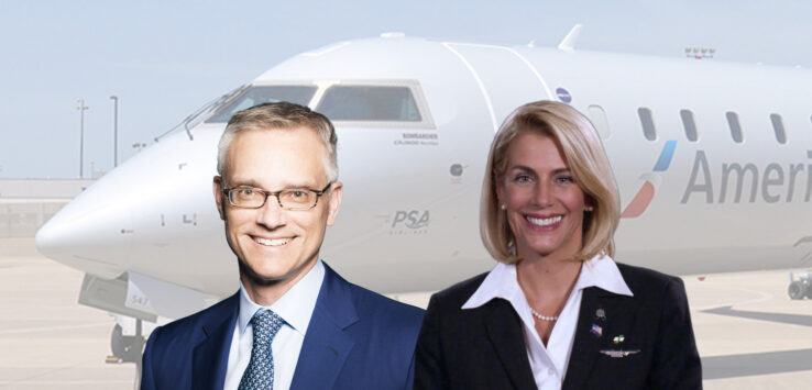 a man and woman standing in front of an airplane