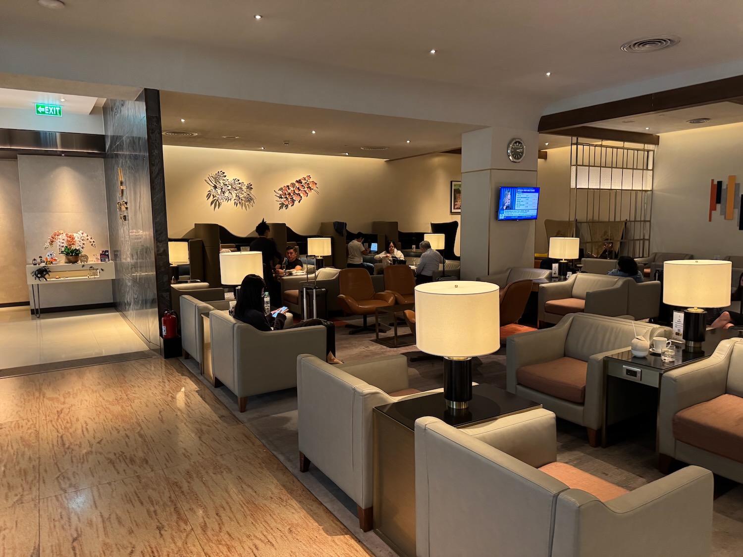 a room with couches and tables and chairs