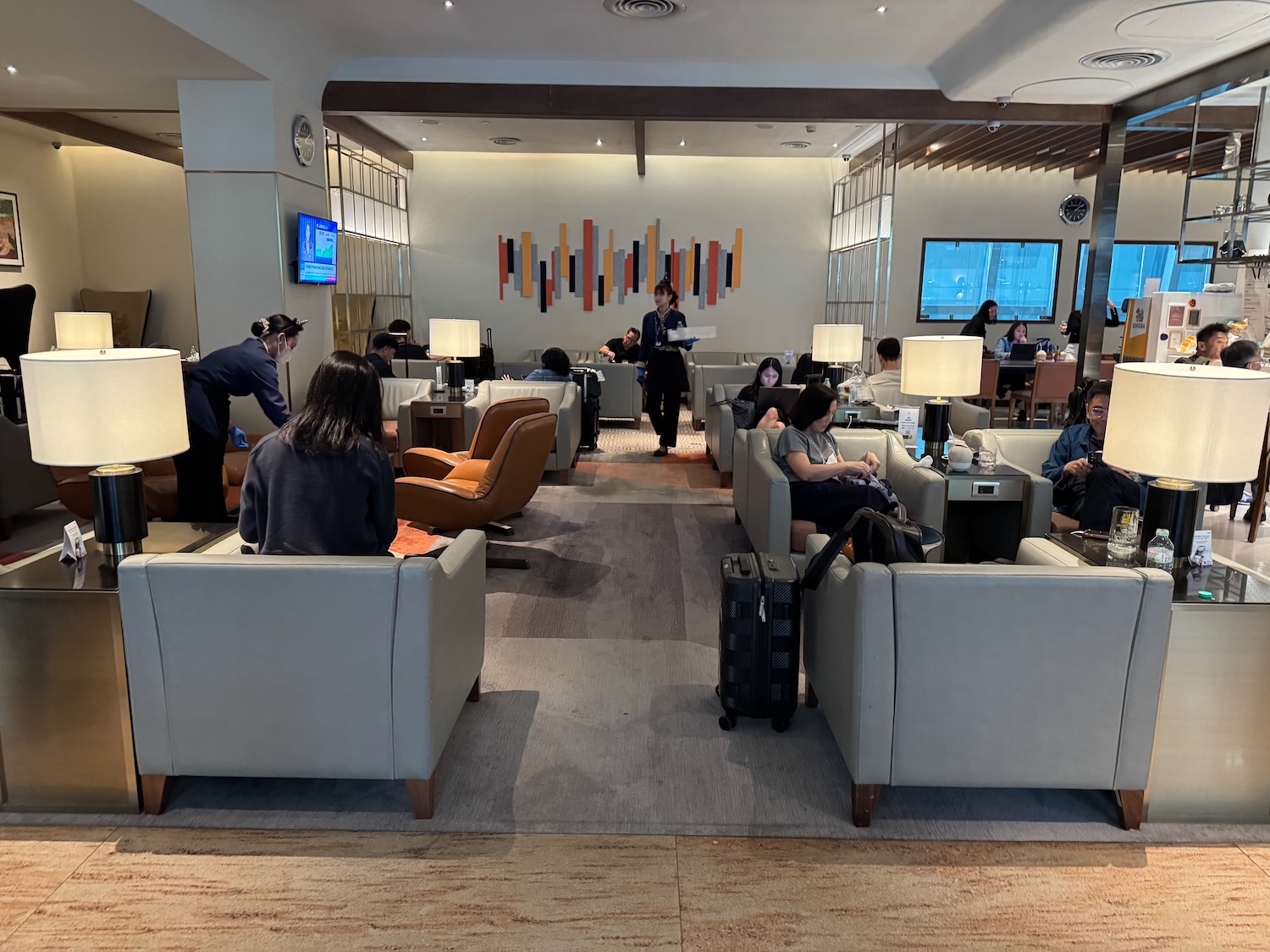 a group of people sitting in a lounge area