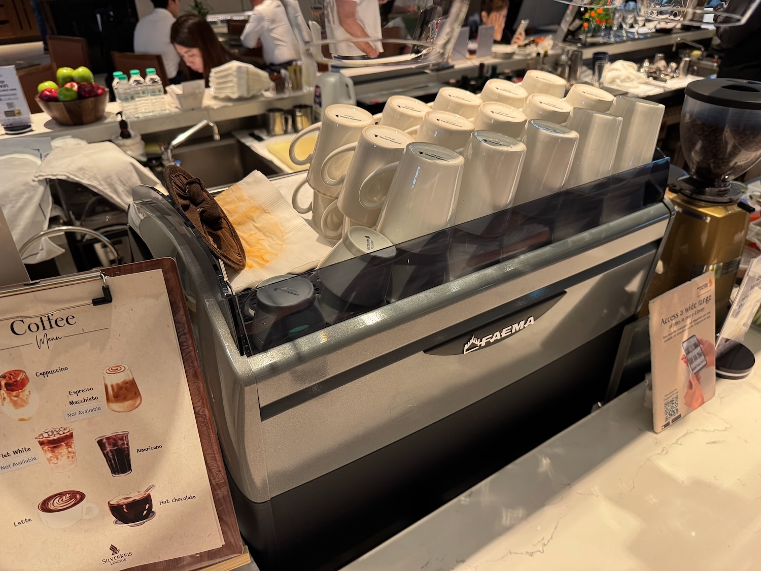 a coffee machine with cups on top