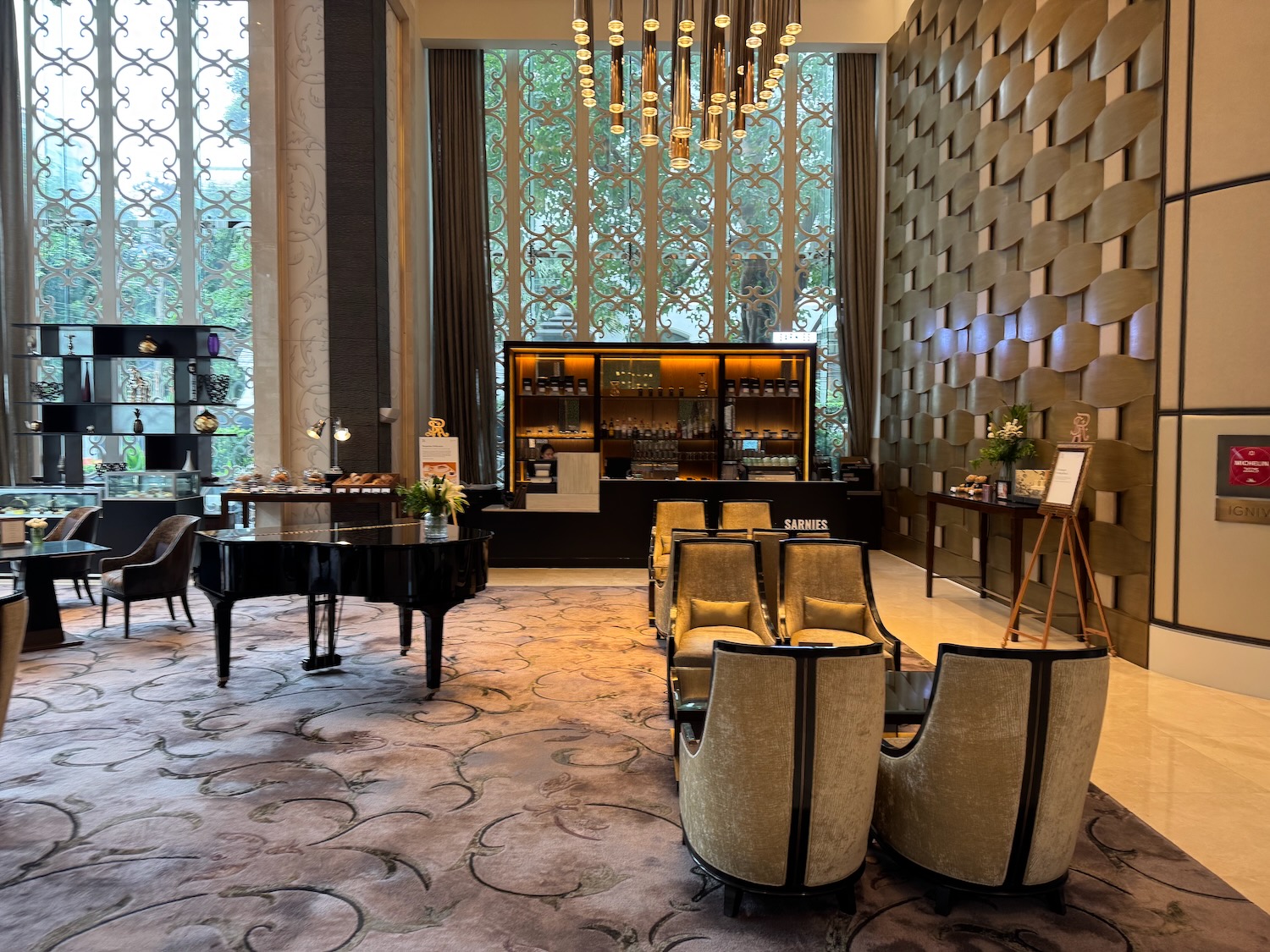 a room with a piano and chairs