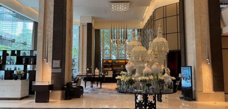 a large room with chandeliers and a table