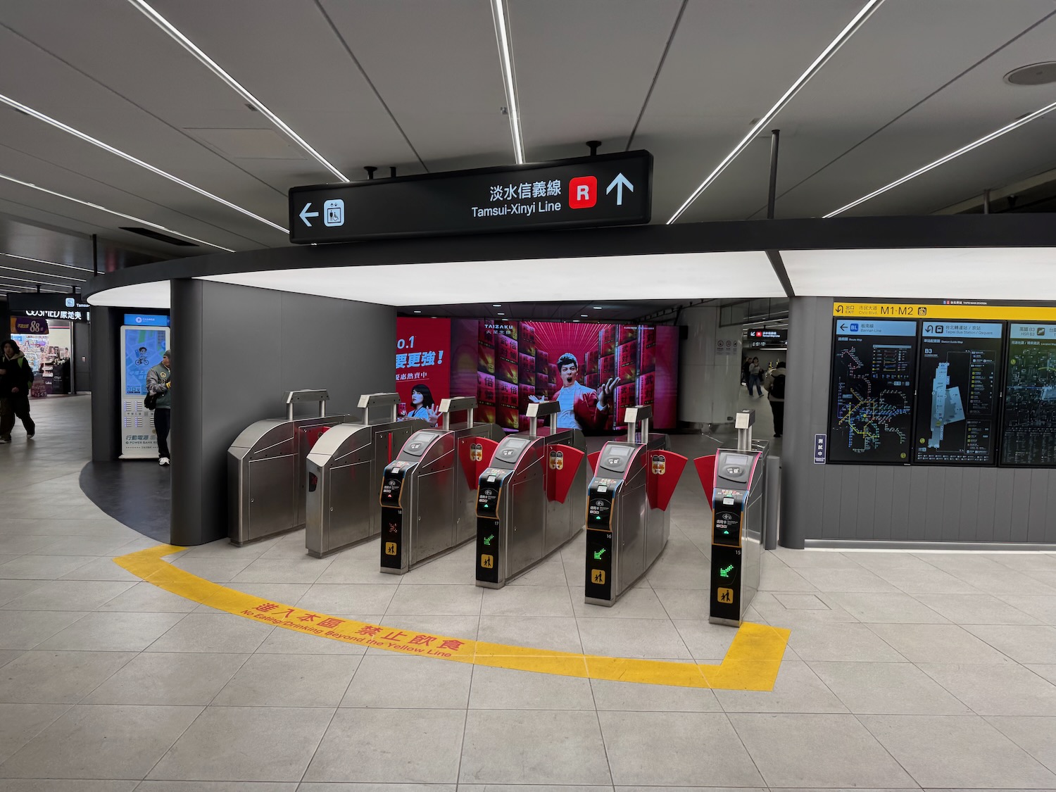 a group of turnstiles in a subway station