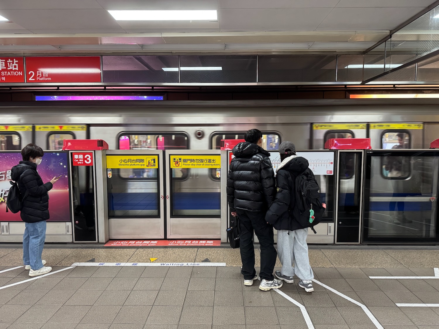 people standing in front of a train