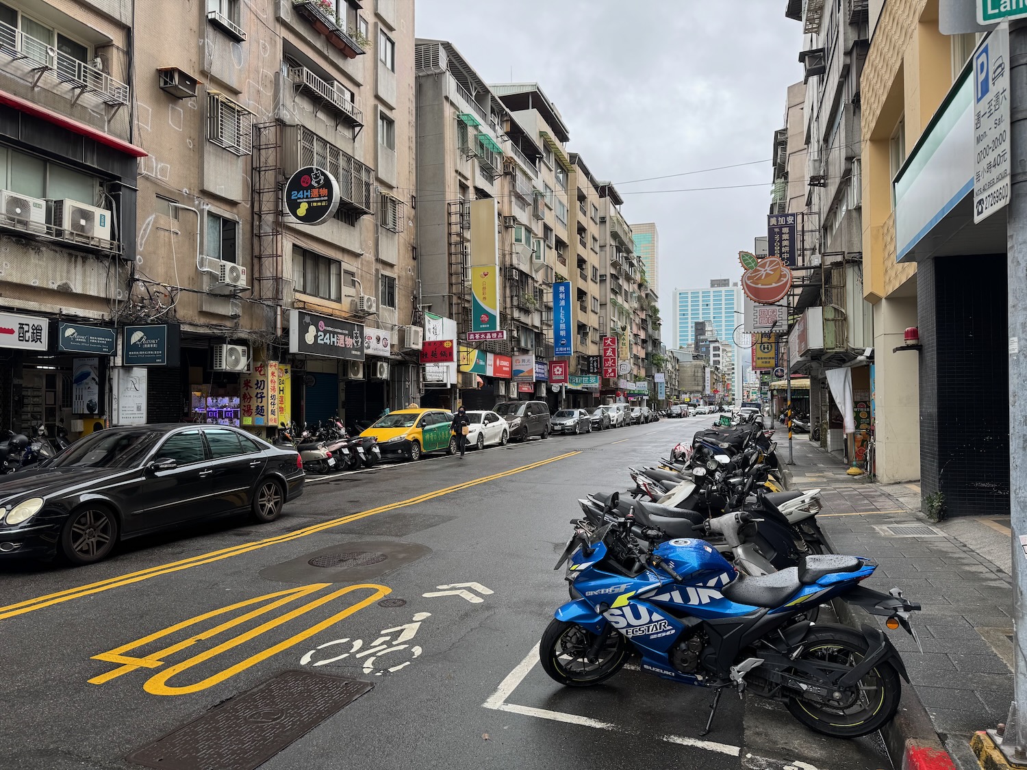 a street with motorcycles parked on it