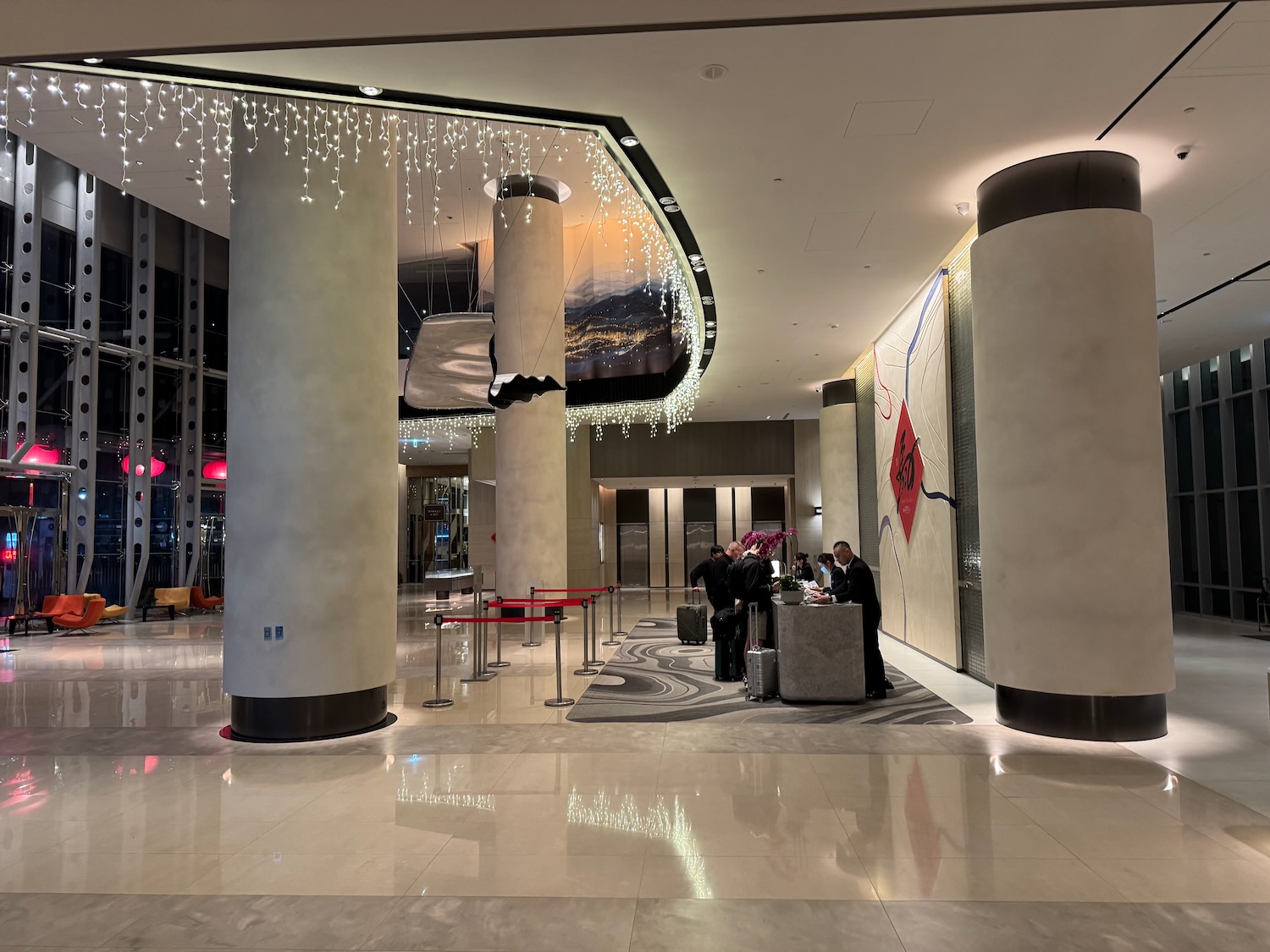 a group of people standing in a lobby