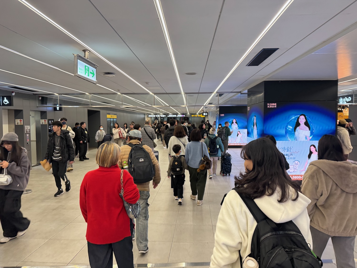 a group of people walking in a building