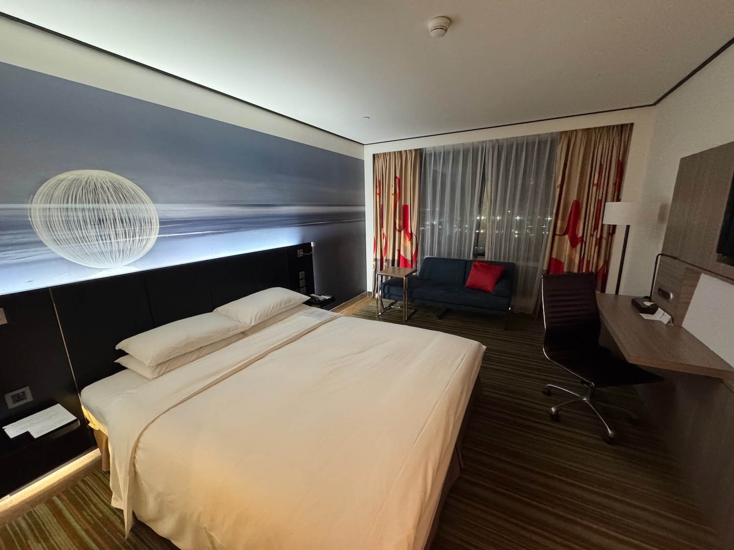 a room with a bed and a desk