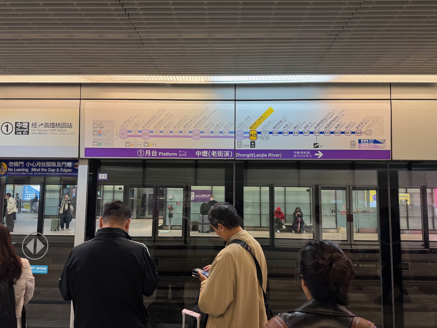 people standing in front of a train