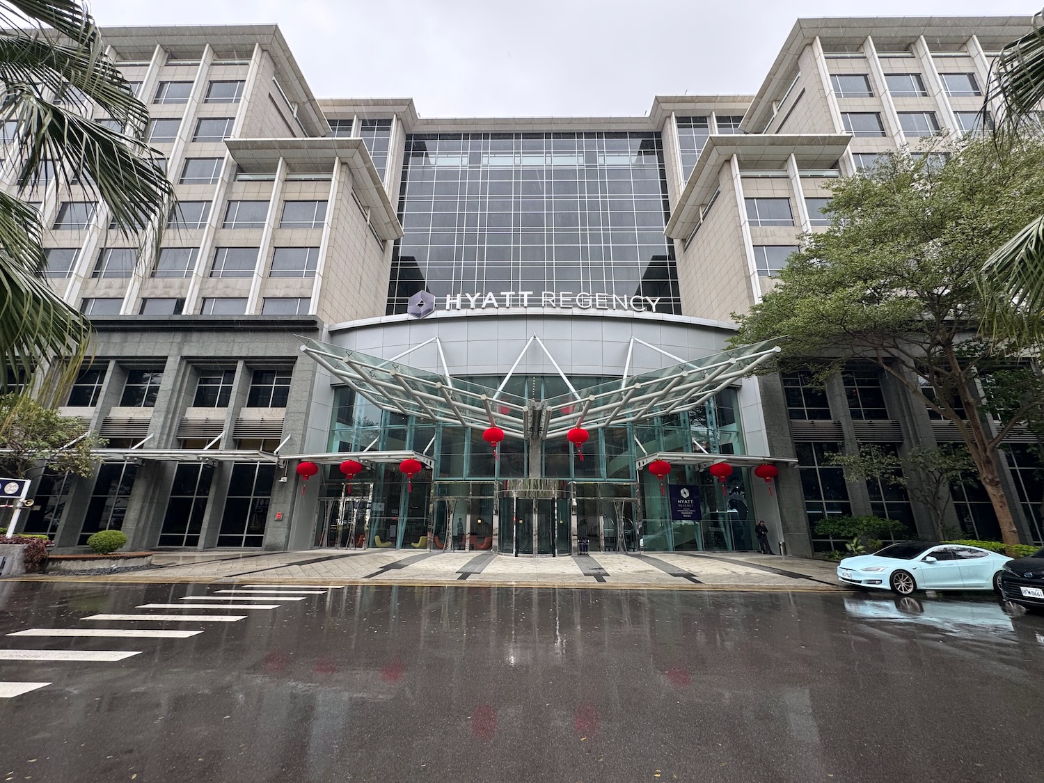 a building with glass doors and red lanterns