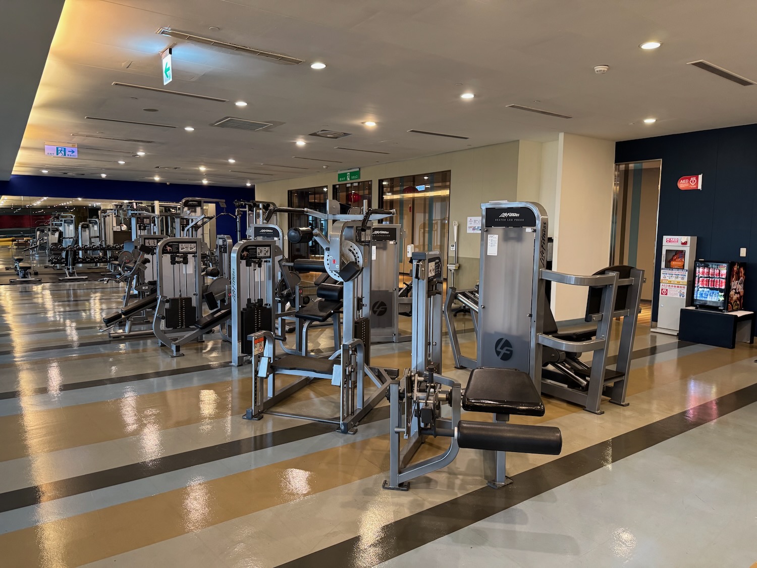 a gym with several exercise equipment