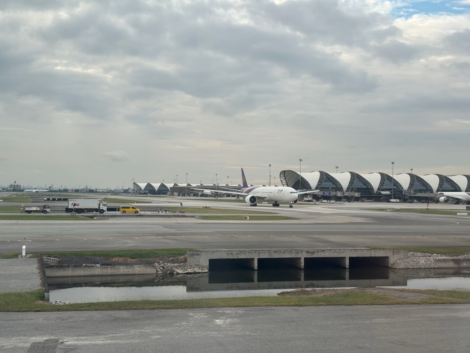 an airport with airplanes on the runway