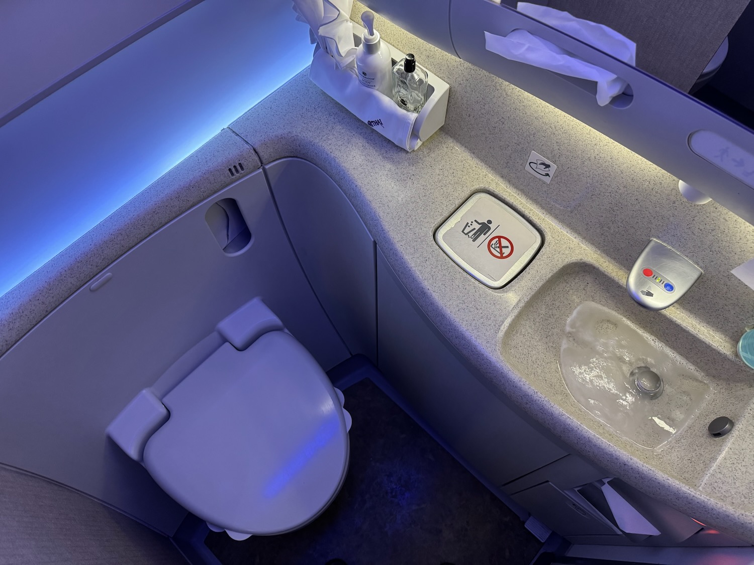 a toilet and sink in a bathroom