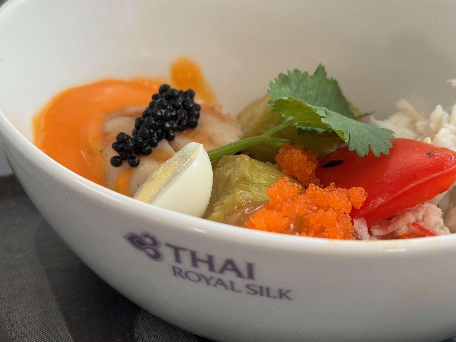 a bowl of food with eggs and vegetables