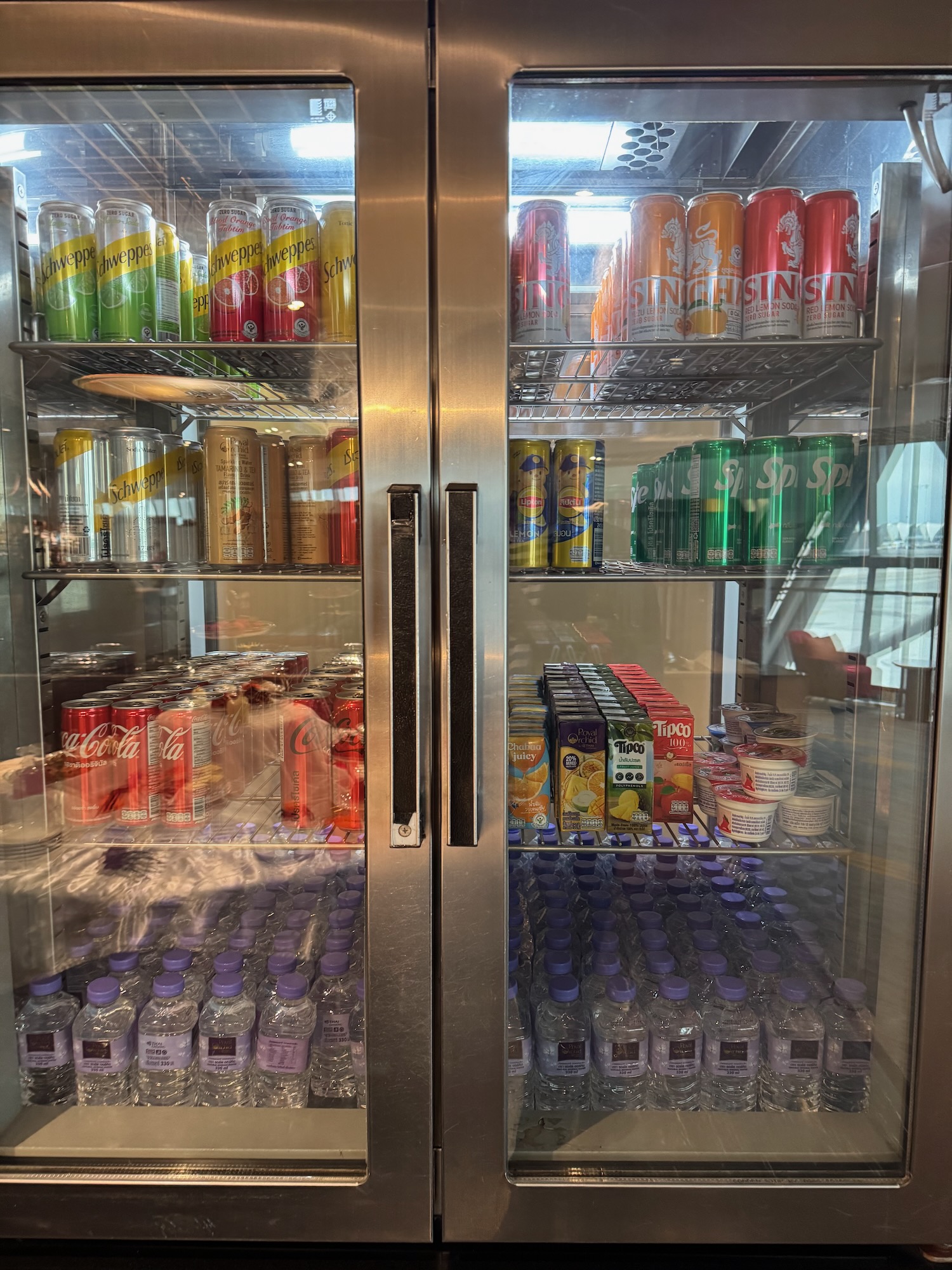 a refrigerator with drinks and beverages