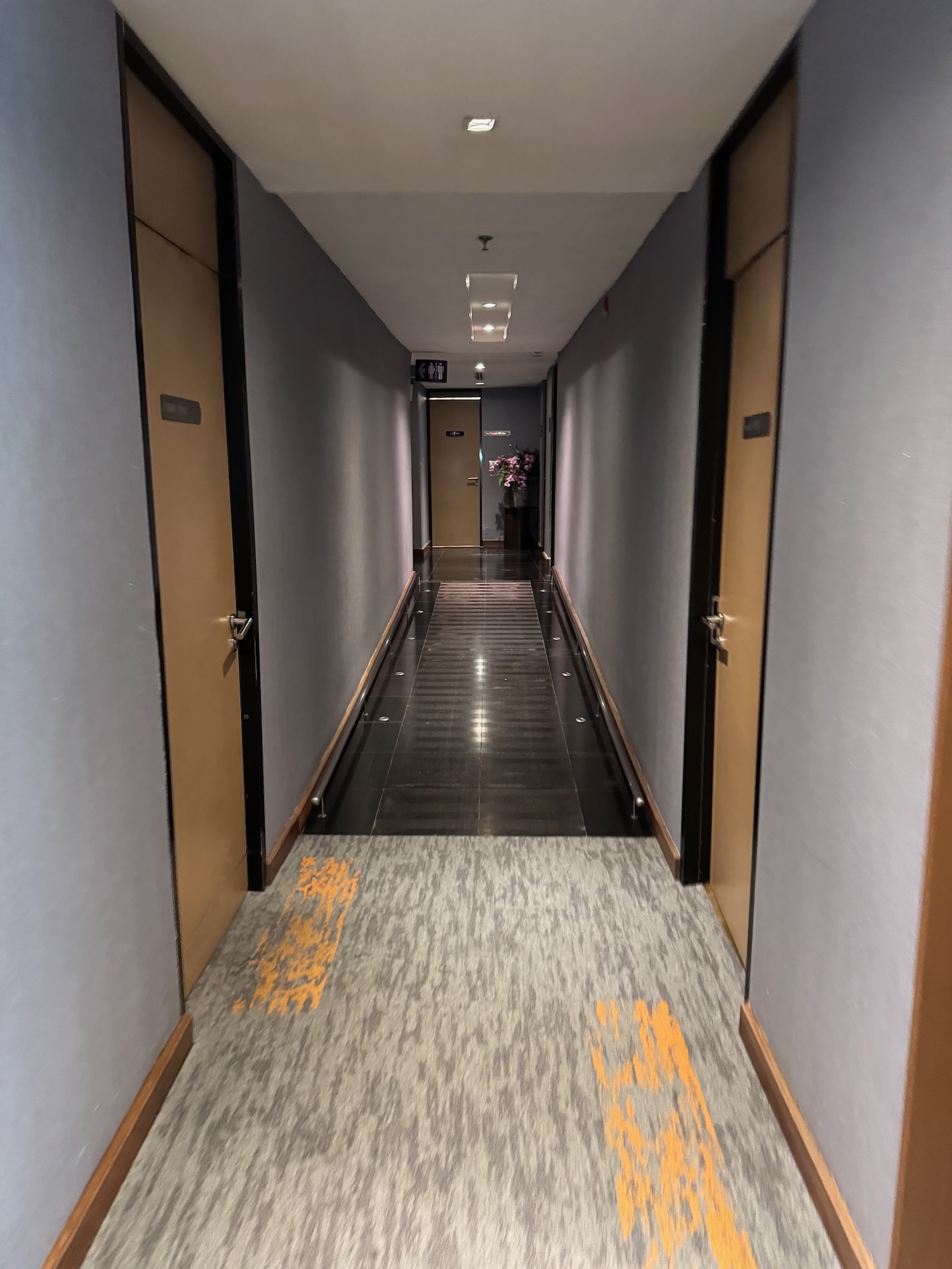 a hallway with a glass walkway