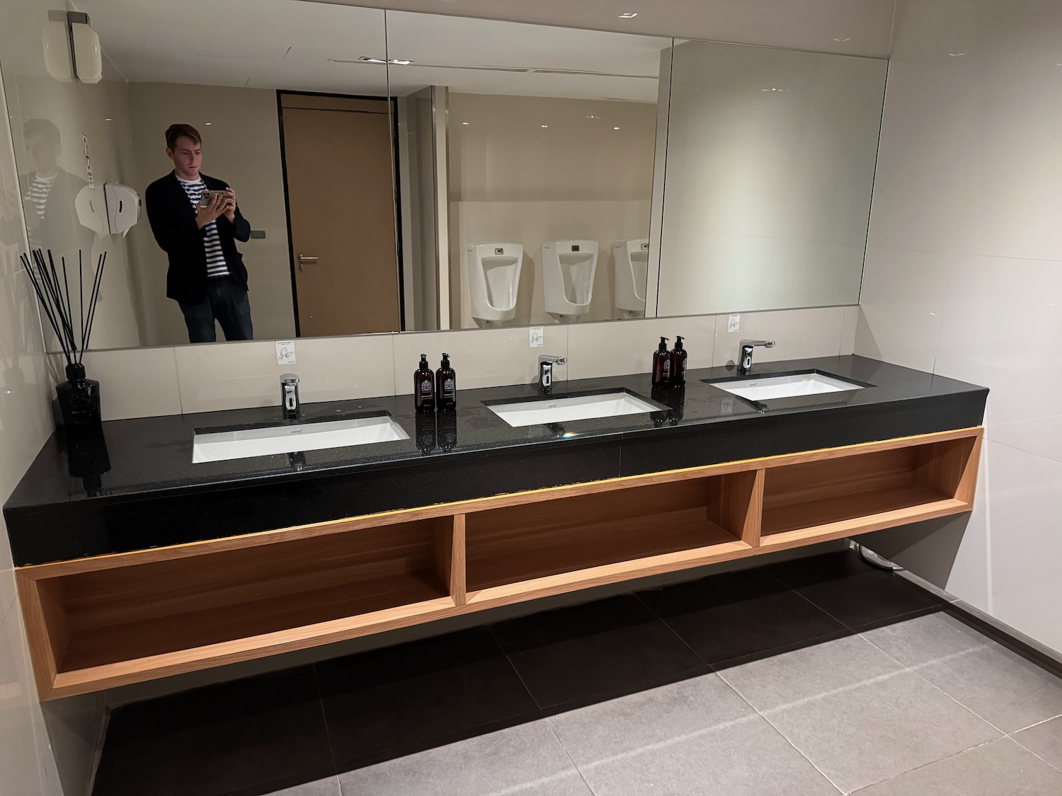 a man taking a selfie in a bathroom